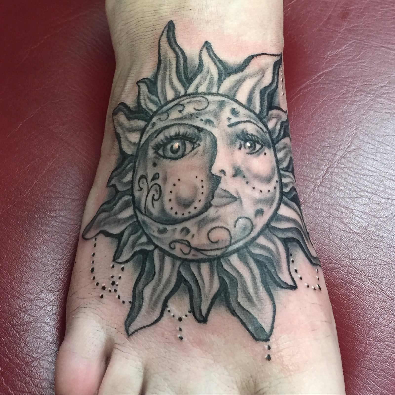 Black And Grey Hippie Sun Tattoo On Foot