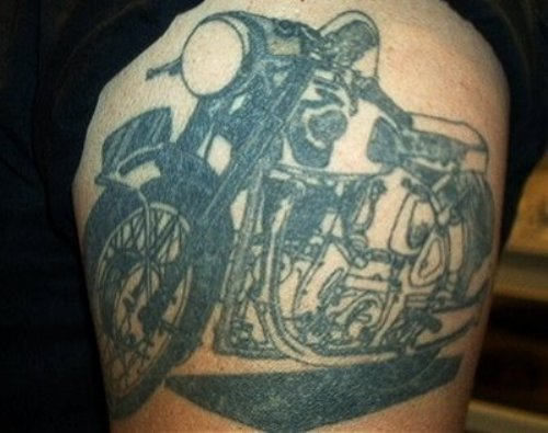 Black And Grey Motorcycle Tattoo On Arm