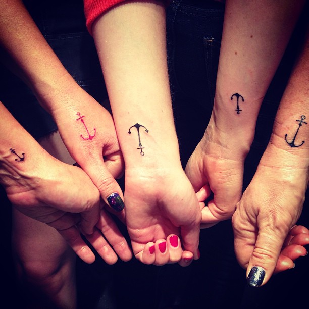Black And Red Friendship Anchor Tattoos On Wrists