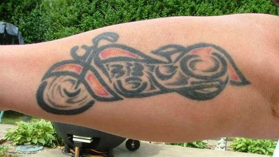 Black And Red Motorcycle Tattoo on Forearm