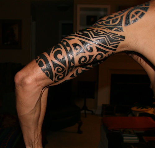 Black Hawaiian Design Tattoo On Left Half Sleeve