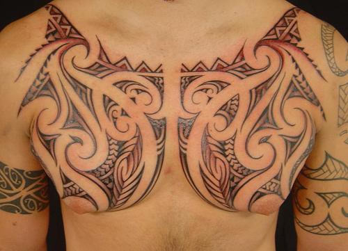 Black Hawaiian Design Tattoo On Man Chest