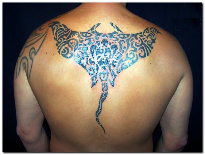 Black Hawaiian Stingray Tattoo On Man Upper Back