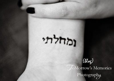Black Hebrew Lettering Tattoo On Girl Wrist