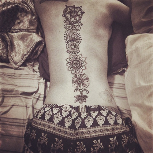 Black Hippie Flowers Tattoo On Full Back