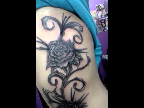 Black Hippie Rose Tattoo Design For Side Rib
