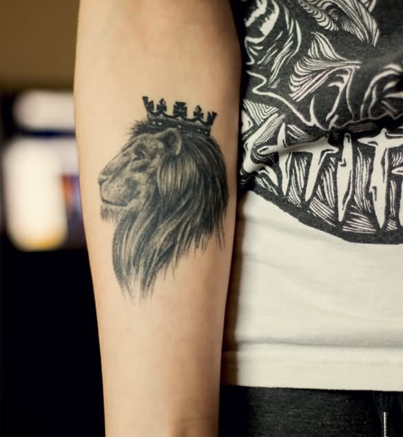 Black Ink Crown On Leo Tattoo On Guy Forearm