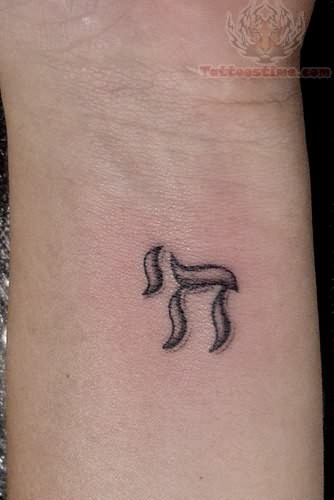 Black Ink Hebrew Symbol Tattoo Design For Wrist