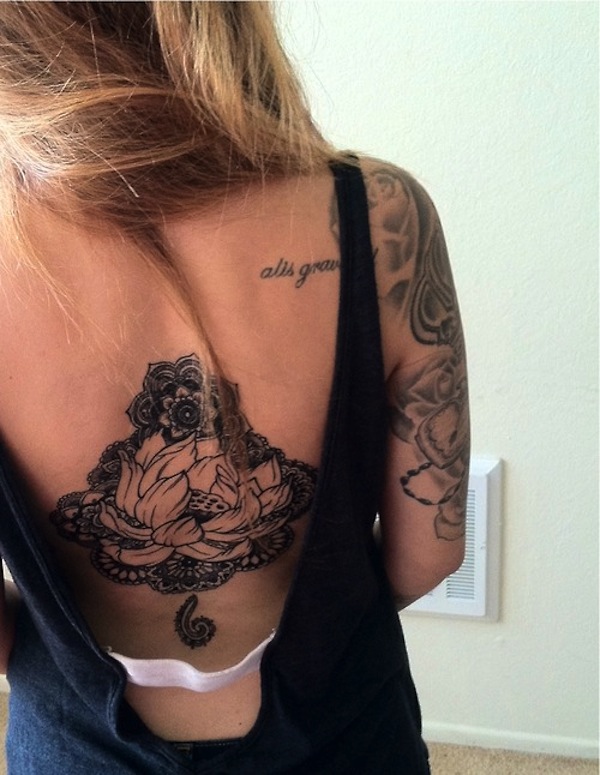 Black Ink Hippie Flower Tattoo On Girl Back
