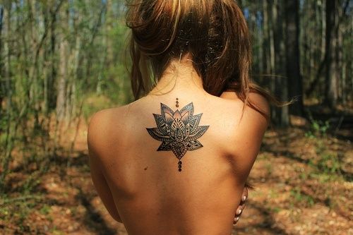 Black Ink Hippie Lotus Tattoo On Girl Upper Back