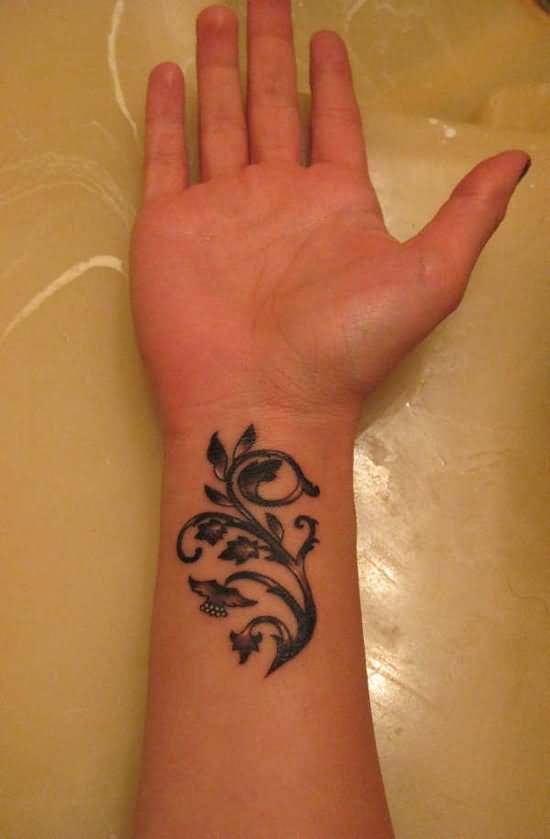 Black Ink Leaves Vine Tattoo On Wrist