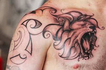 Black Ink Leo Head Tattoo On Man Front Shoulder