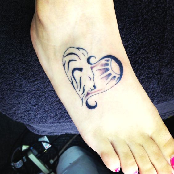 Black Ink Leo Heart Tattoo On Girl Foot