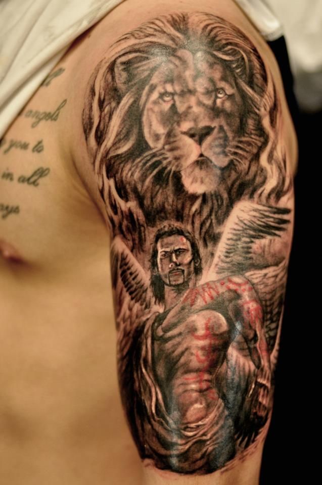 Black Ink Leo With Warrior Tattoo On Man Left Half Sleeve By Joe
