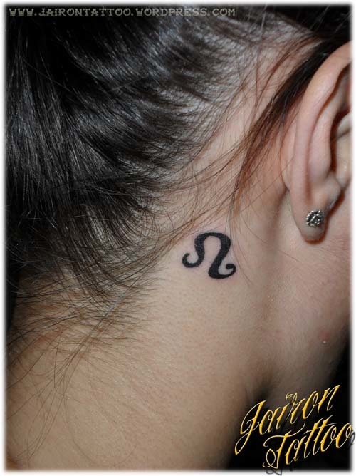 Black Leo Heart Symbol Tattoo On Girl Behind The Ear
