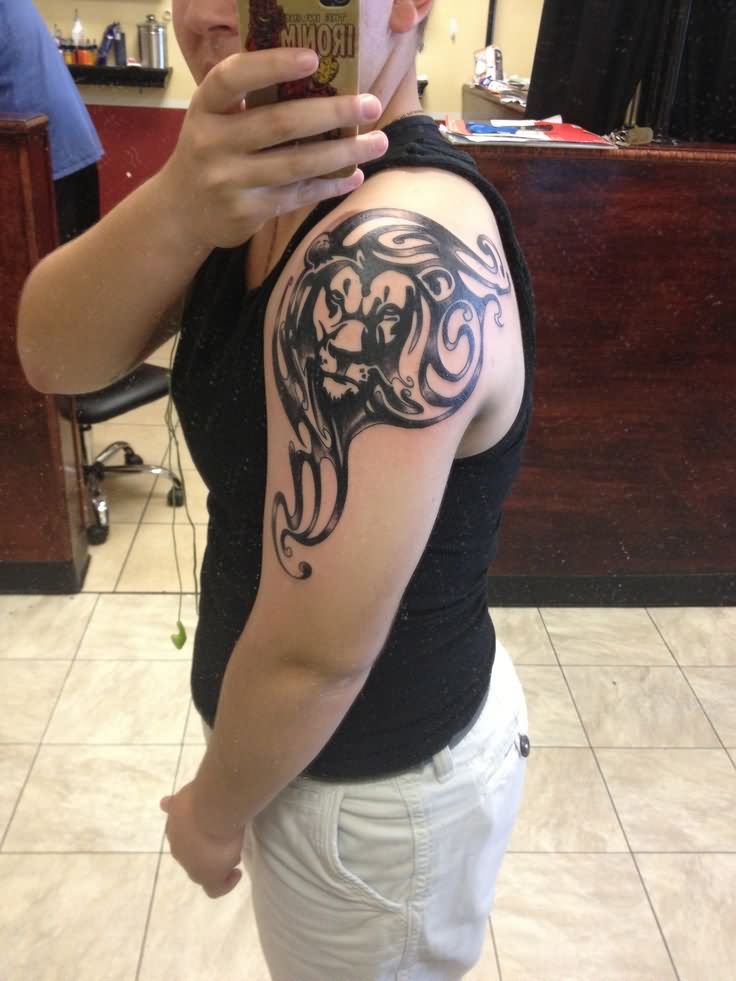Black Leo Tattoo On Guy Left Shoulder