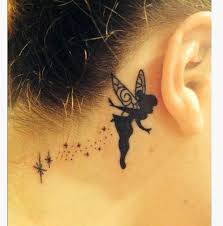 Black Tinkerbell Tattoo On Girl Behind The Ear