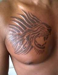 Black Tribal Leo Tattoo On Guy Chest