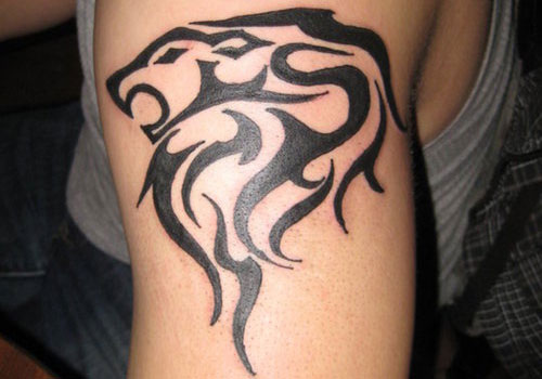 Black Tribal Leo Tattoo On Left Arm