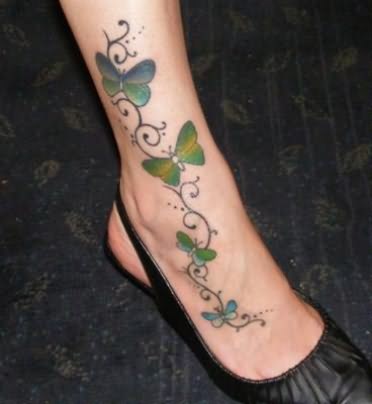 Black Vine With Butterflies Tattoo On Girl Foot