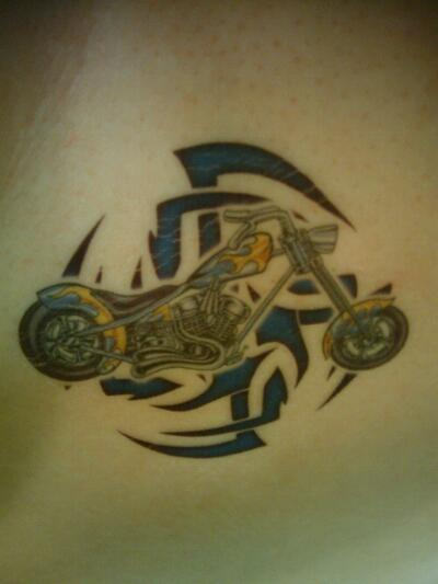 Blue Tribal Motorcycle Tattoo On Collarbone