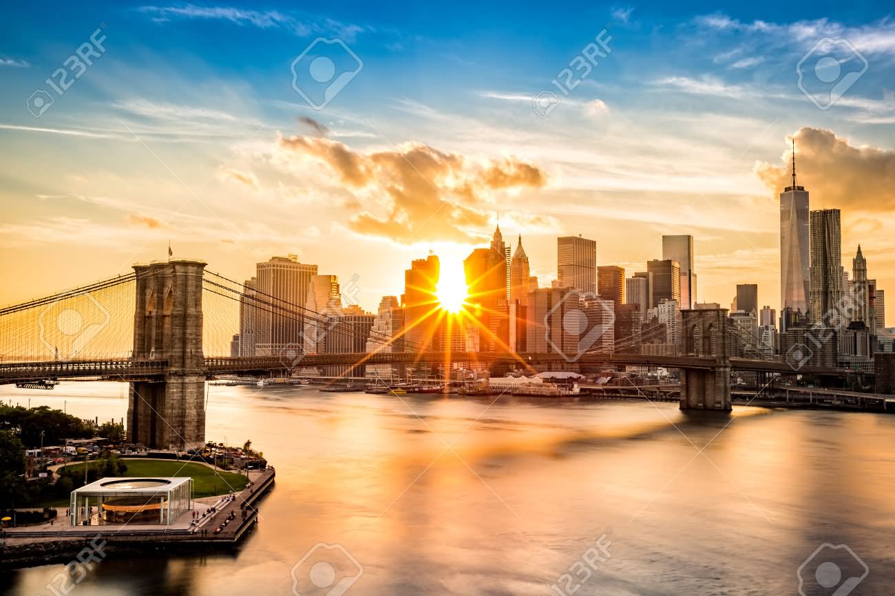 Brooklyn Bridge And The Lower Manhattan At Sunset Time