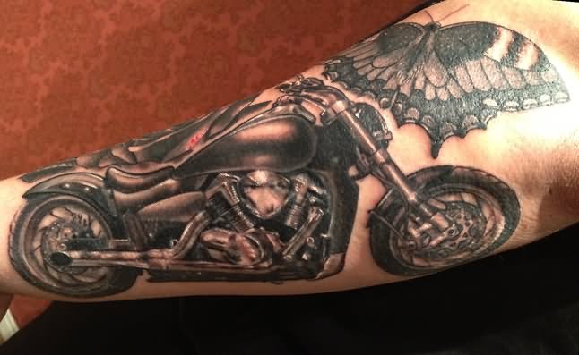 Butterfly And Motorcycle Tattoo On Left Arm