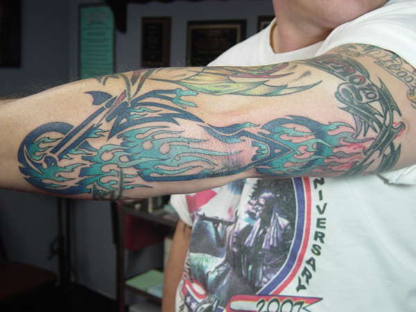 Color Tribal Flames Motorcycle Tattoo On Left Sleeve