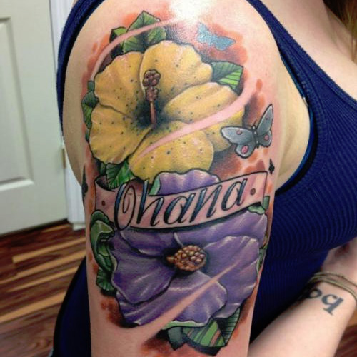 Colorful Hawaiian Flowers With Banner Tattoo On Girl Right Half Sleeve