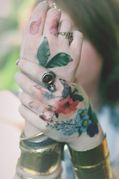 Colorful Hippie Flowers Tattoo On Girl Hand