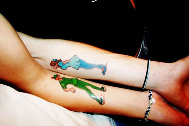 Colorful Tinkerbell And Peter Pan Tattoo On Couple Forearm