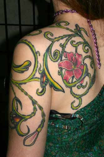 Colorful Vine Flower Tattoo On Girl Left Back Shoulder