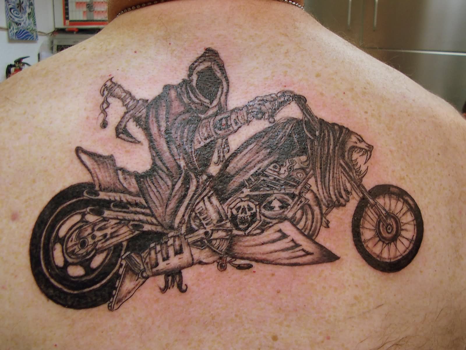Cool Biker On Motorbike Tattoo On Upper Back