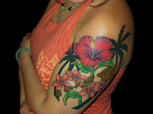 Cool Hawaiian Flowers Tattoo On Left Half Sleeve