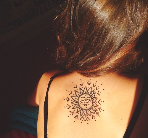 Cool Hippie Sun Tattoo On Girl Upper Back