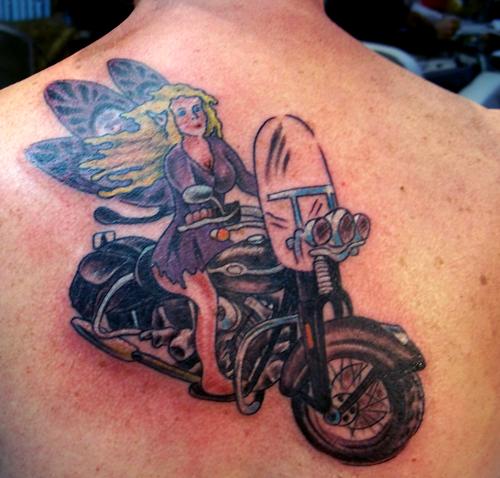 Fairy Riding Motorcycle Tattoo On Upper Back