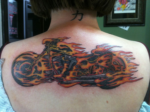 Flaming Motorcycle Tattoo On Girl Upper Back