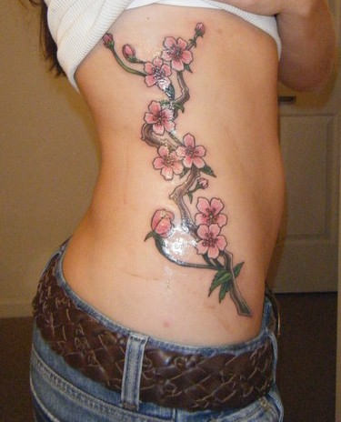 Flowers Vine Tattoo On Girl Side Rib