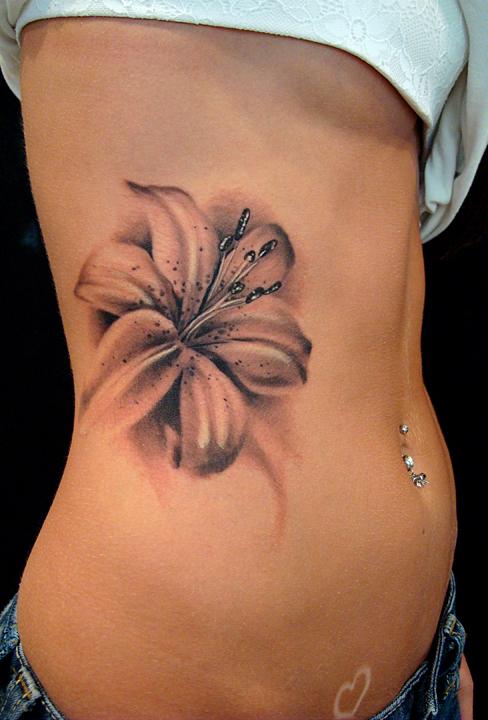 Grey Ink Hawaiian Flower Tattoo On Girl Side Rib