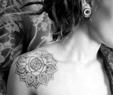 Grey Ink Hippie Flower Tattoo On Girl Right Front Shoulder