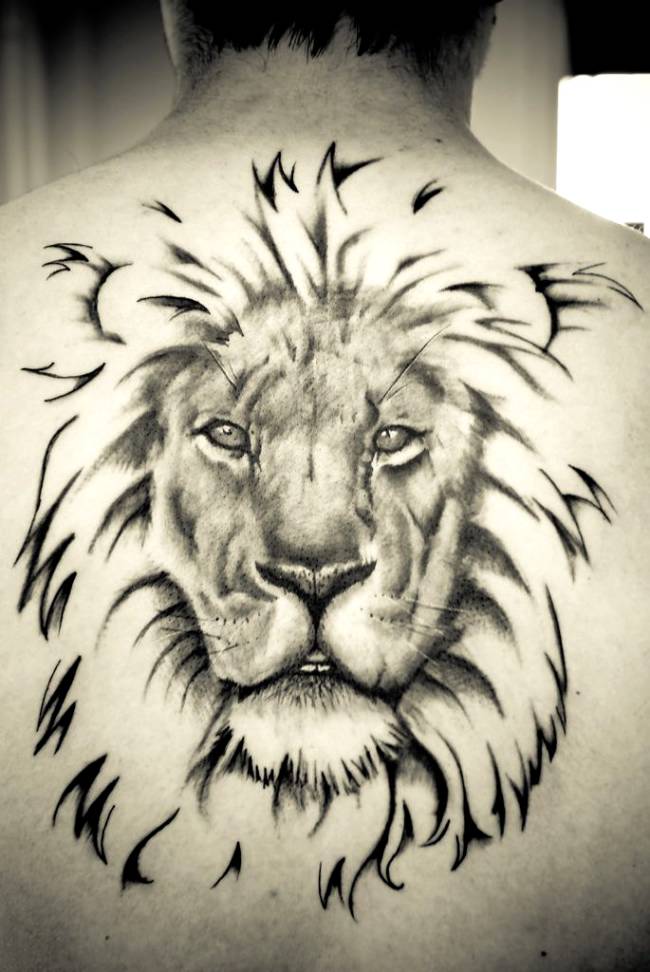 Grey Ink Leo Tattoo On Man Upper Back