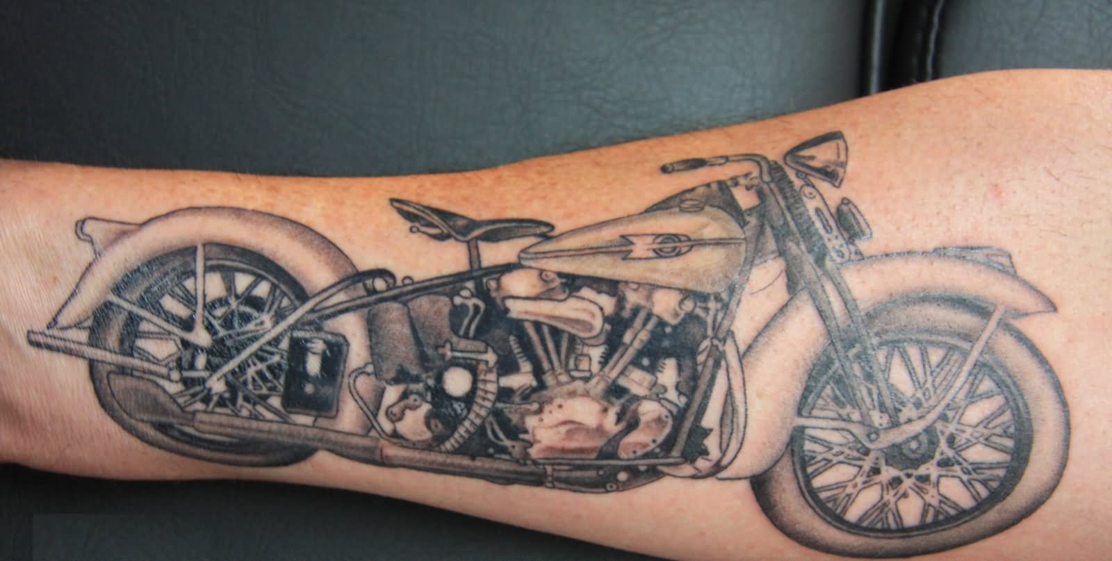 Grey Ink Motorbike Tattoo On Forearm