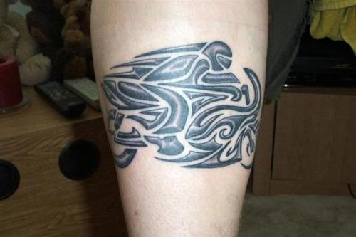 Grey Ink Tribal Motorbike Tattoo On Leg
