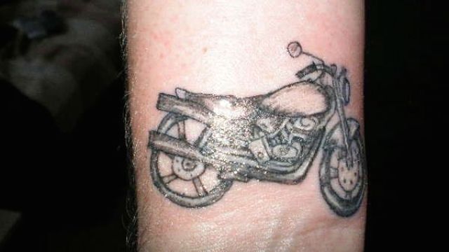 Grey Motorcycle Tattoo On Wrist