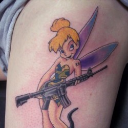Gun In Tinkerbell Hand Tattoo Design For Shoulder