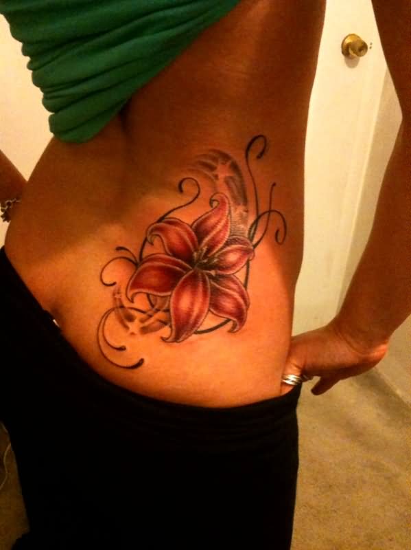 Hawaiian Flower Tattoo On Girl Lower Back