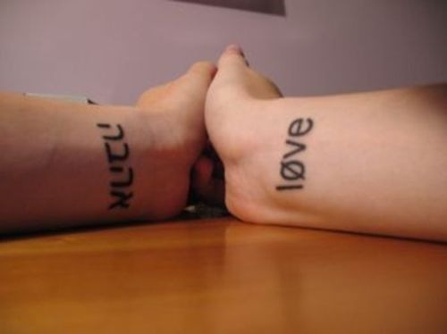 Hebrew Lettering Tattoo On Couple Wrist