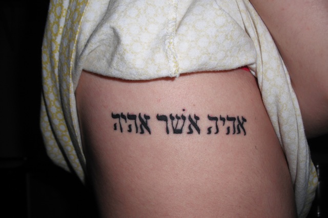 Hebrew Lettering Tattoo On Girl Right Side Rib