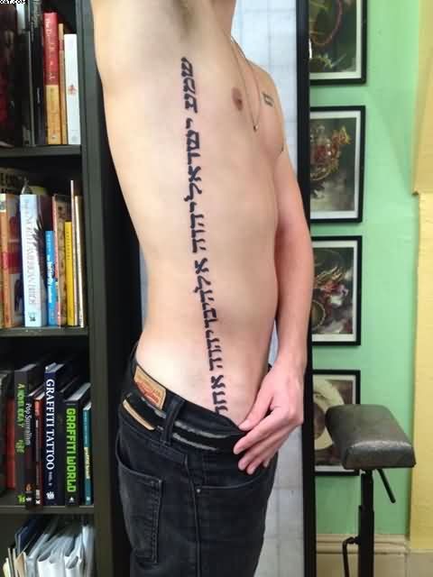 Hebrew Lettering Tattoo On Man Right Side Rib