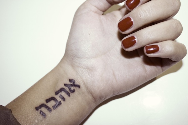 Hebrew Phrase Tattoo On Girl Wrist
